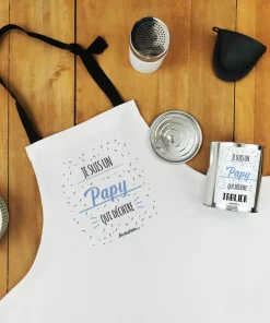 Tablier de cuisine dans sa boîte de conserve “Je suis un papy qui déchire”