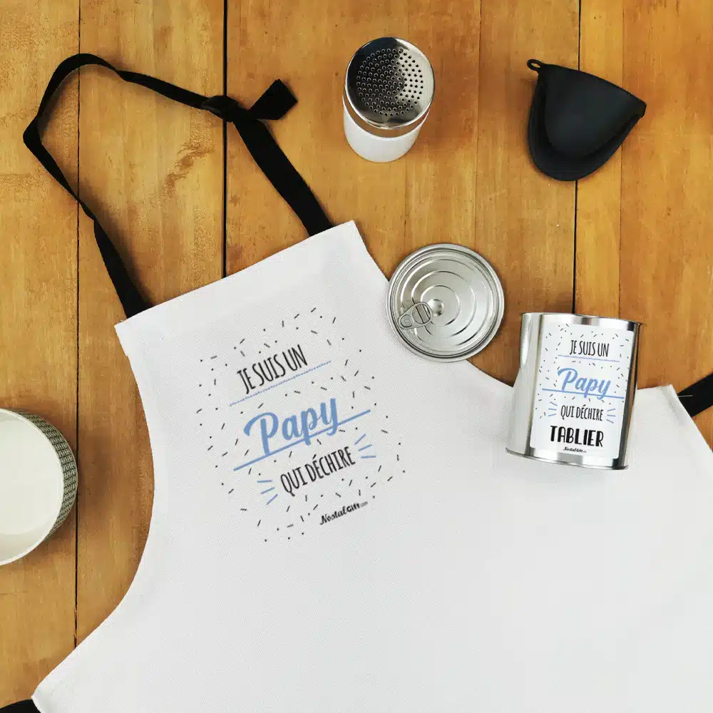 Tablier de cuisine dans sa boîte de conserve “Je suis un papy qui déchire”